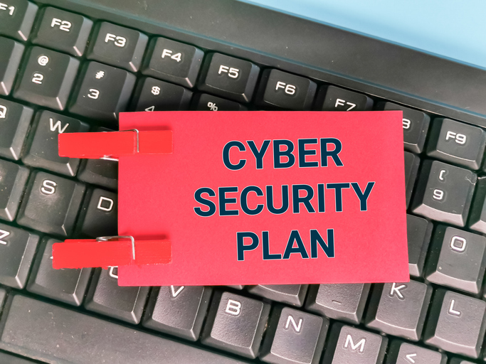 A Red cybersecurity plan, likely a WISP sitting on a black keyboard.